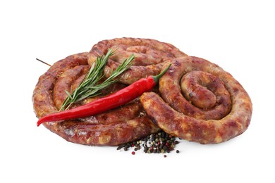 Photo of Rings of delicious homemade sausage with spices and chili pepper isolated on white