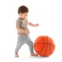 Photo of Cute baby playing with ball on white background. Learning to walk