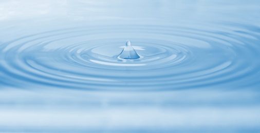 Photo of Splash of water with drops as background, closeup