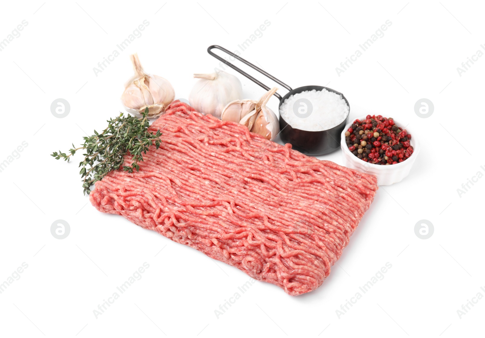 Photo of Fresh raw ground meat, spices, garlic and thyme isolated on white