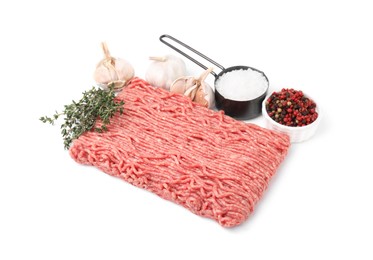 Photo of Fresh raw ground meat, spices, garlic and thyme isolated on white