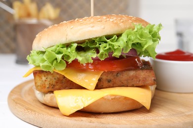 Photo of Delicious burger with tofu and fresh vegetables on white table, closeup