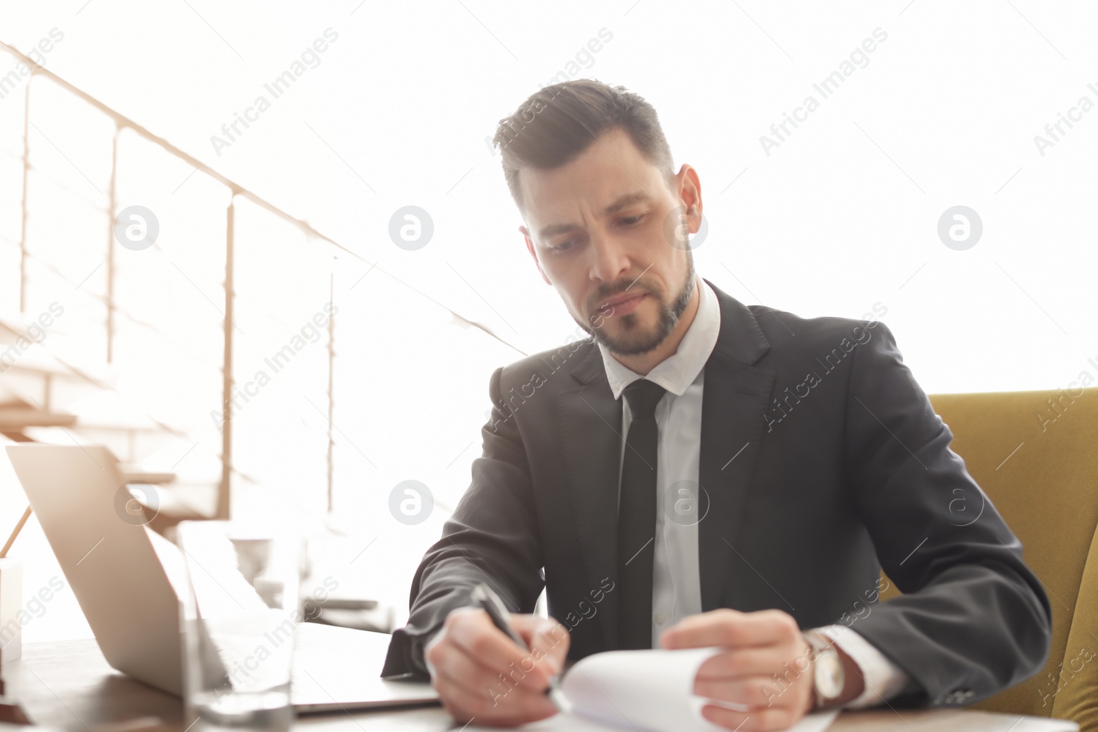 Photo of Male lawyer working in office