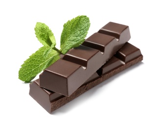 Pieces of dark chocolate with mint on white background