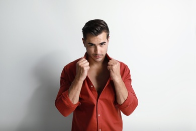 Portrait of handsome young man on white background