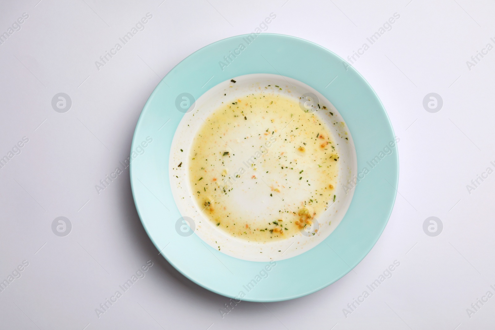 Photo of Dirty plate with food leftovers on white background, top view