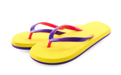 Photo of Pair of stylish yellow flip flops isolated on white. Beach object