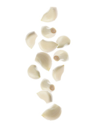 Image of Set of falling garlic cloves on white background