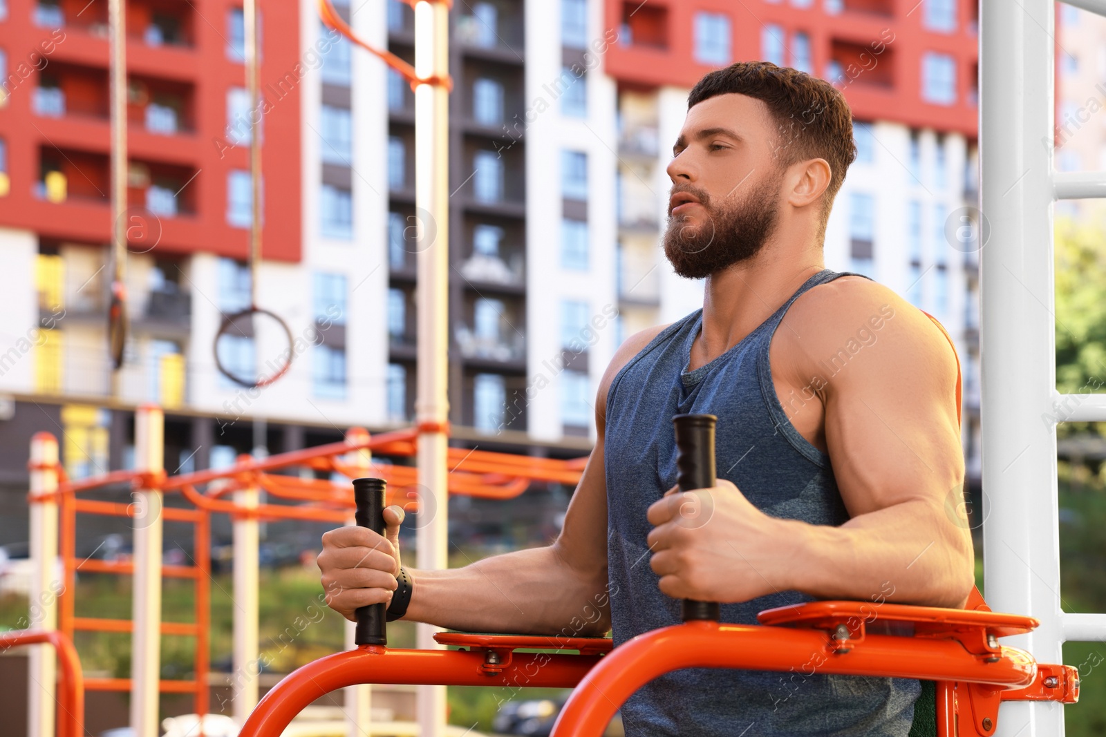 Photo of Man training on abs station at outdoor gym