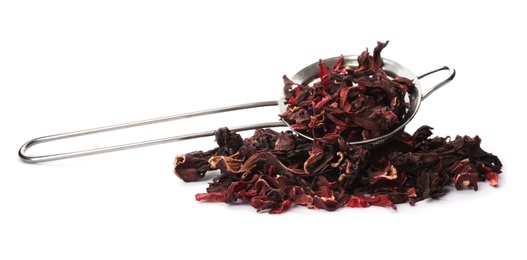 Photo of Dry hibiscus tea and sieve on white background