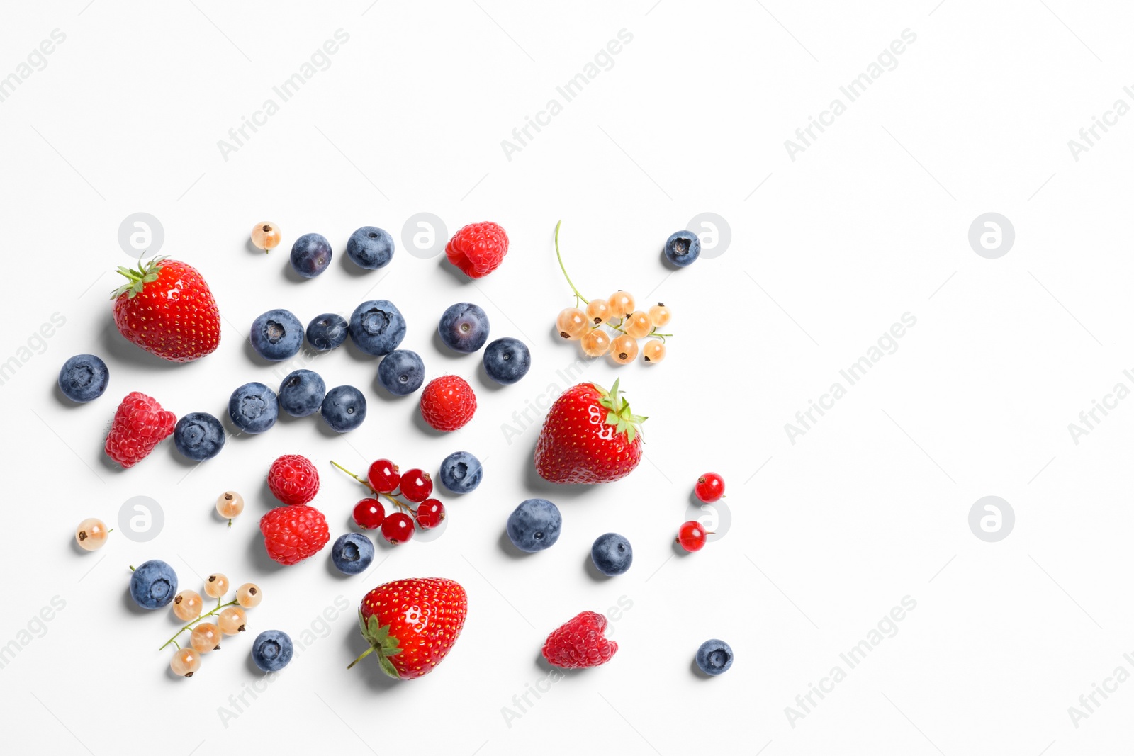 Photo of Raspberries and different berries on white background