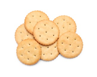 Photo of Tasty crispy round crackers isolated on white, top view