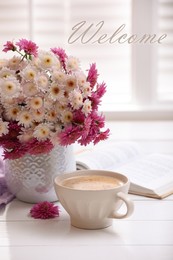 Welcome card. Cup of fresh coffee, open book and beautiful bouquet on white wooden table near window