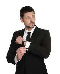 Man wearing stylish suit and cufflinks on white background