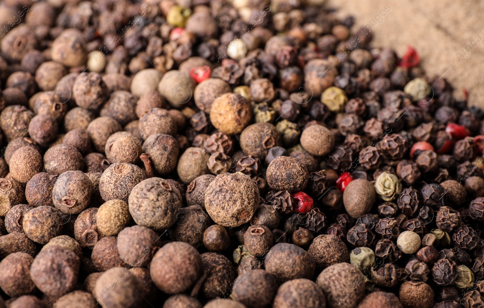 Photo of Different spicy peppers as background, closeup view