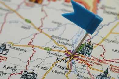 MYKOLAIV, UKRAINE - NOVEMBER 09, 2020: Kyiv city marked with push pin on map of Ukraine, closeup