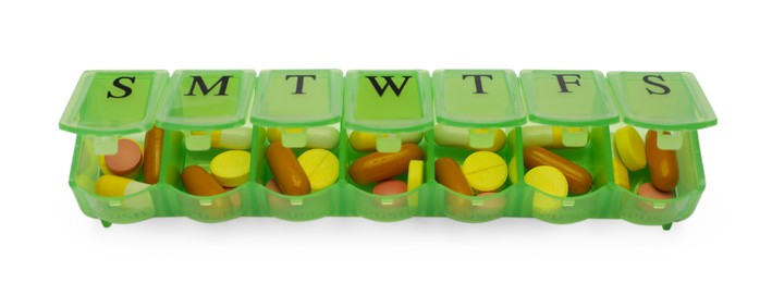 Different pills in organizer isolated on white