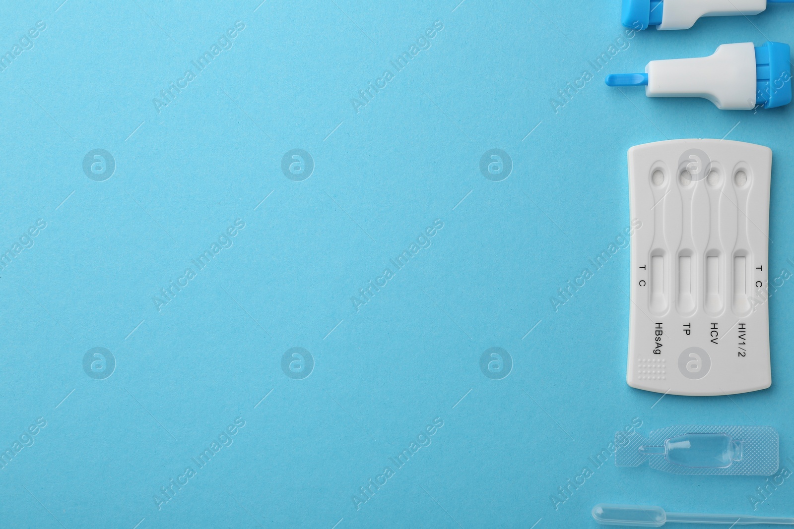 Photo of Disposable multi-infection express test kit on light blue background, flat lay. Space for text