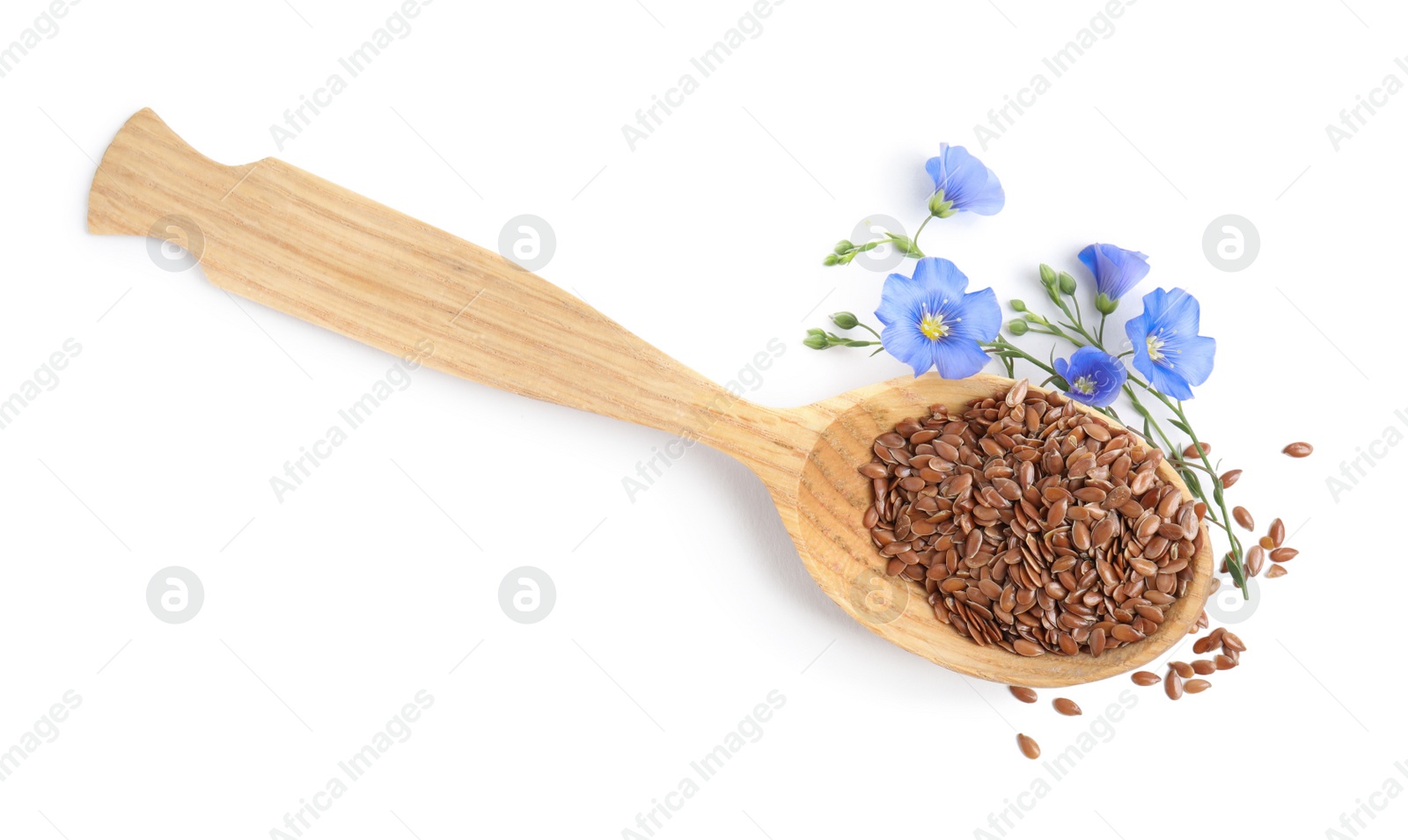 Photo of Wooden spoon with flax flowers and seeds on white background, top view