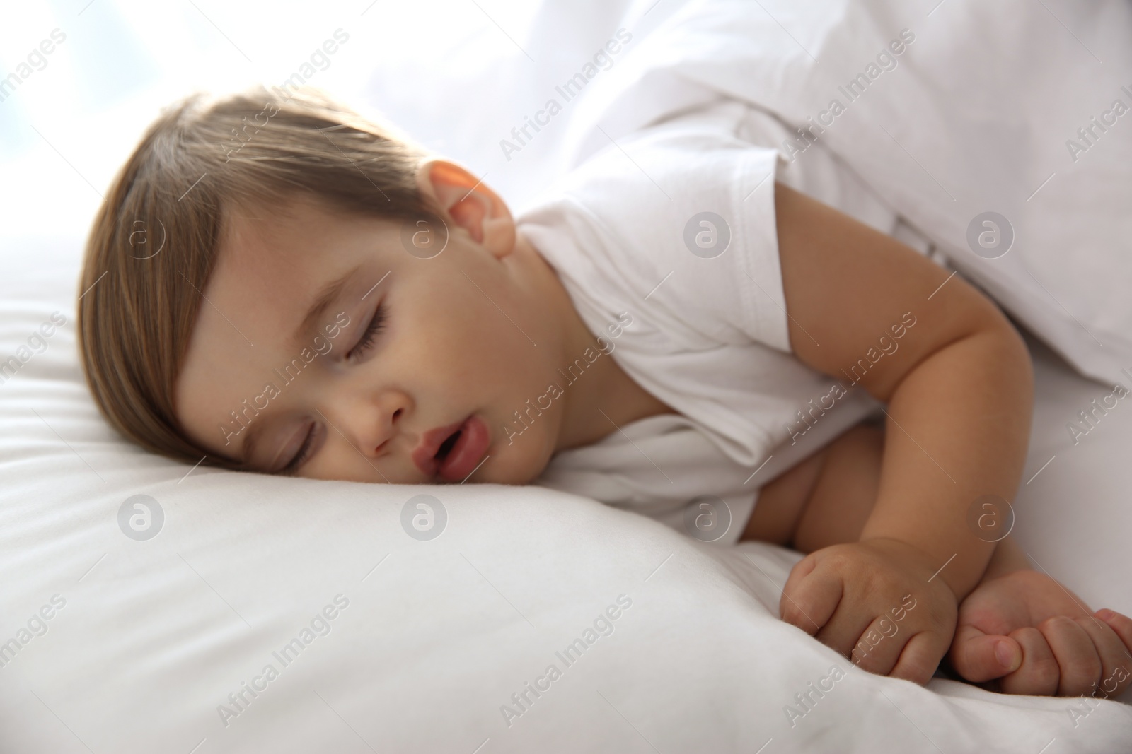 Photo of Cute little baby peacefully sleeping at home. Bedtime