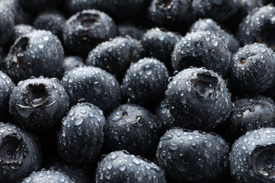 Photo of Wet fresh blueberries as background, closeup view