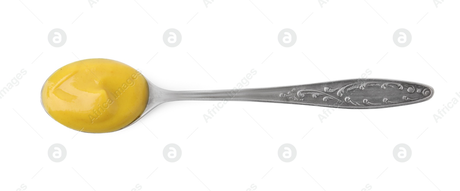 Photo of Spoon of tasty curry sauce isolated on white, top view