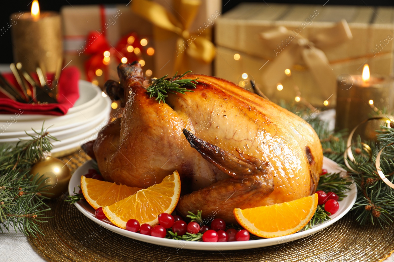 Photo of Delicious roasted turkey served for Christmas dinner on table