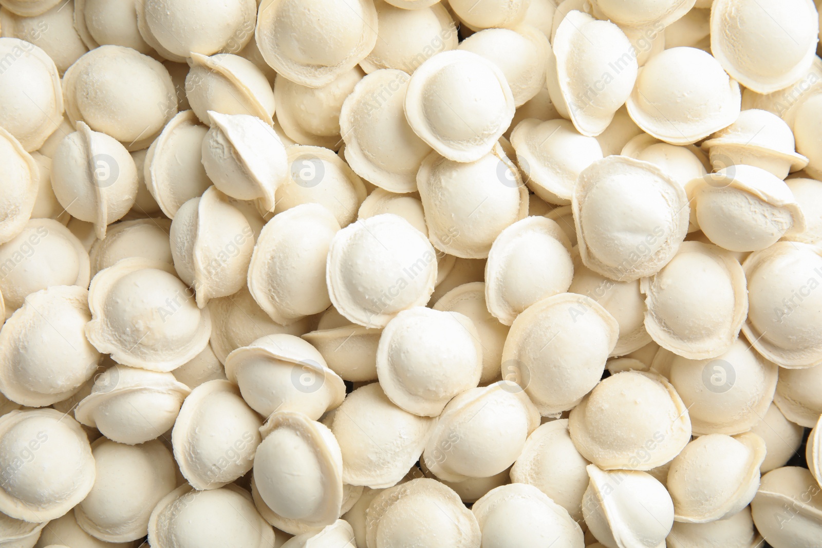 Photo of Raw dumplings as background, top view. Home cooking