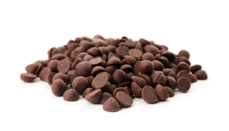 Photo of Pile of delicious dark chocolate chips on white background