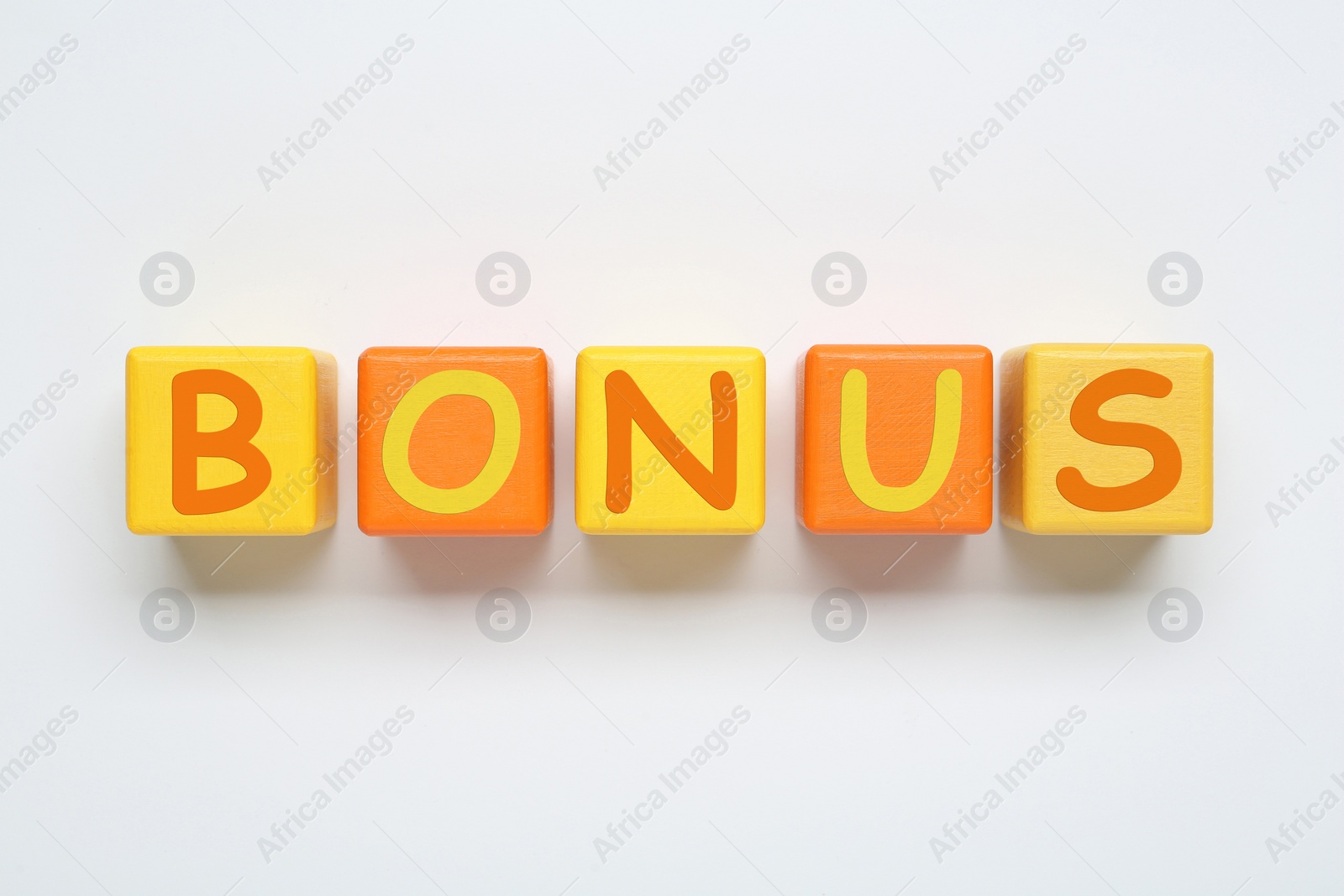 Image of Word Bonus made of color cubes with letters on white background, top view