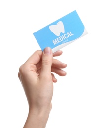 Photo of Woman holding business card isolated on white, closeup. Dental medical service