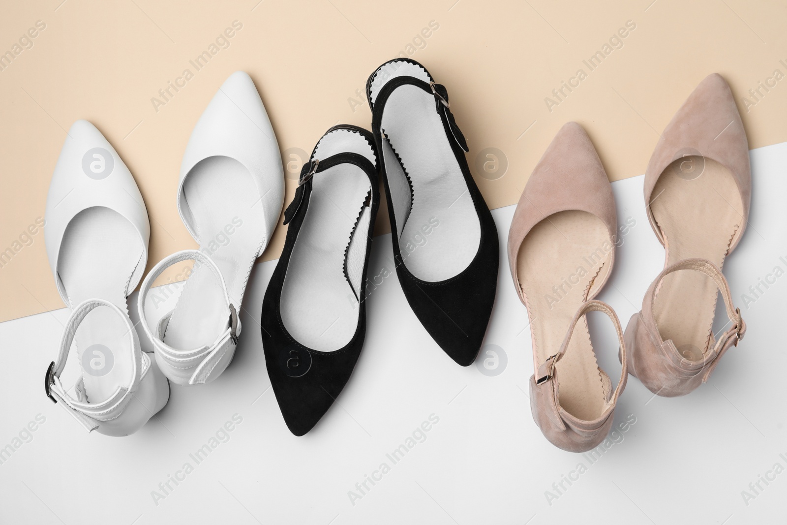 Photo of Many stylish female shoes on color background, flat lay