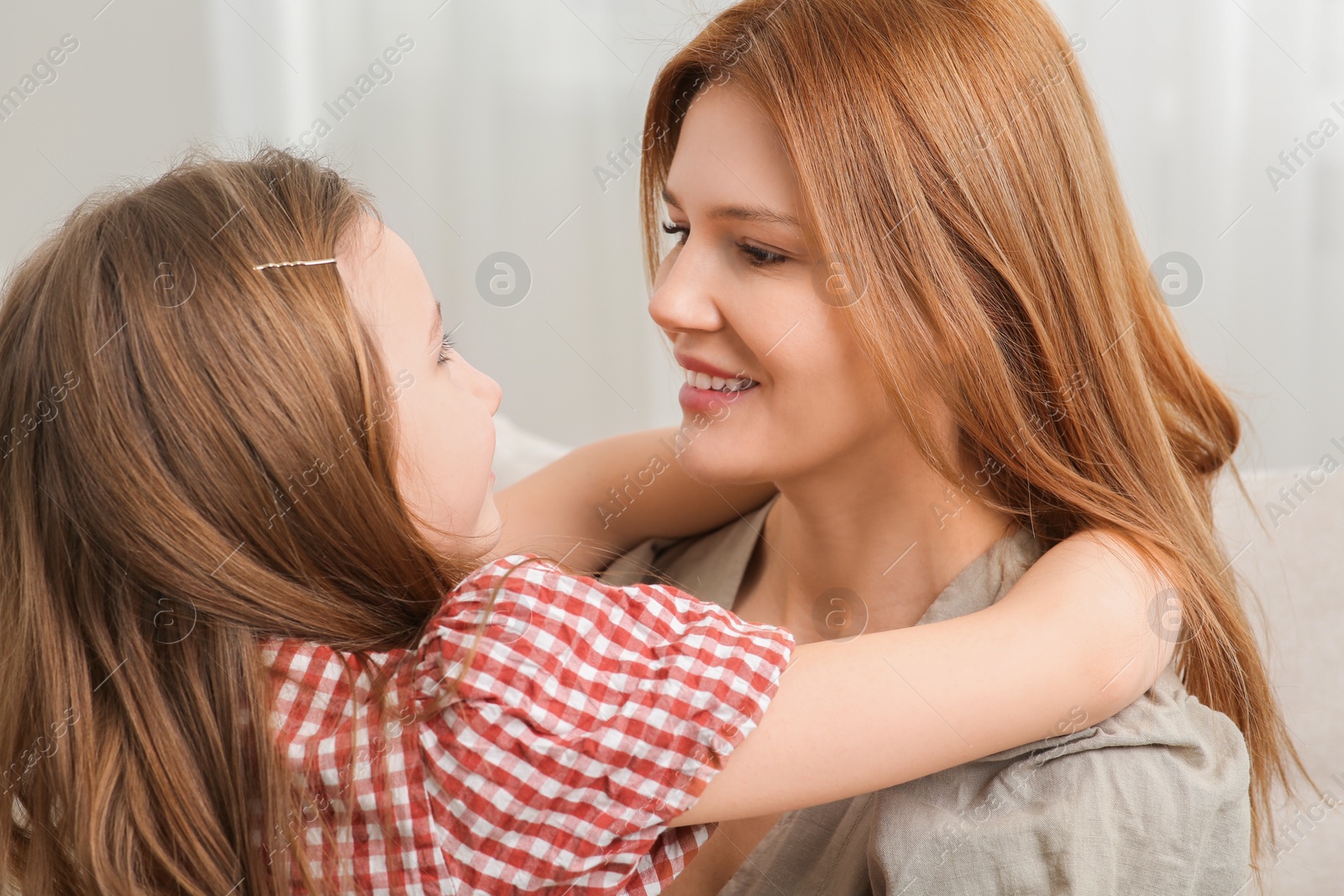 Photo of Happy mother and her cute daughter at home