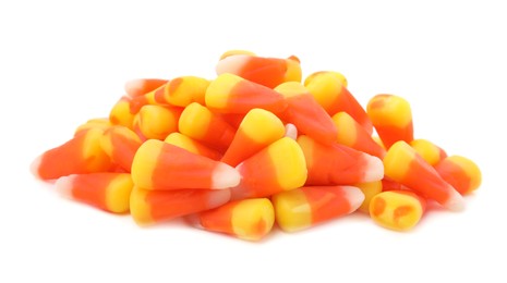 Photo of Delicious colorful candies on white background. Halloween sweets