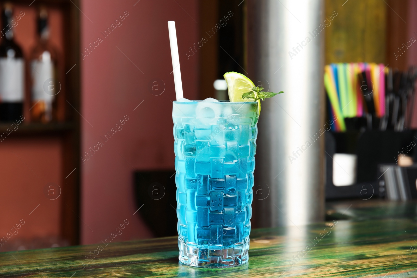 Photo of Glass with delicious cocktail on table in cafe