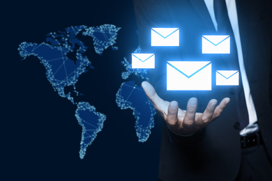 Image of Electronic mail. Businessman demonstrating virtual image of envelopes, closeup