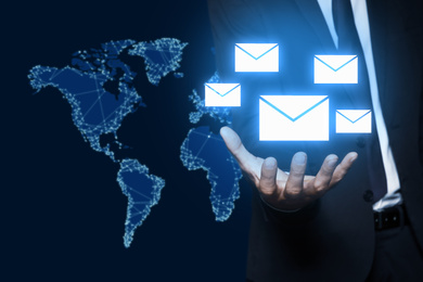 Electronic mail. Businessman demonstrating virtual image of envelopes, closeup