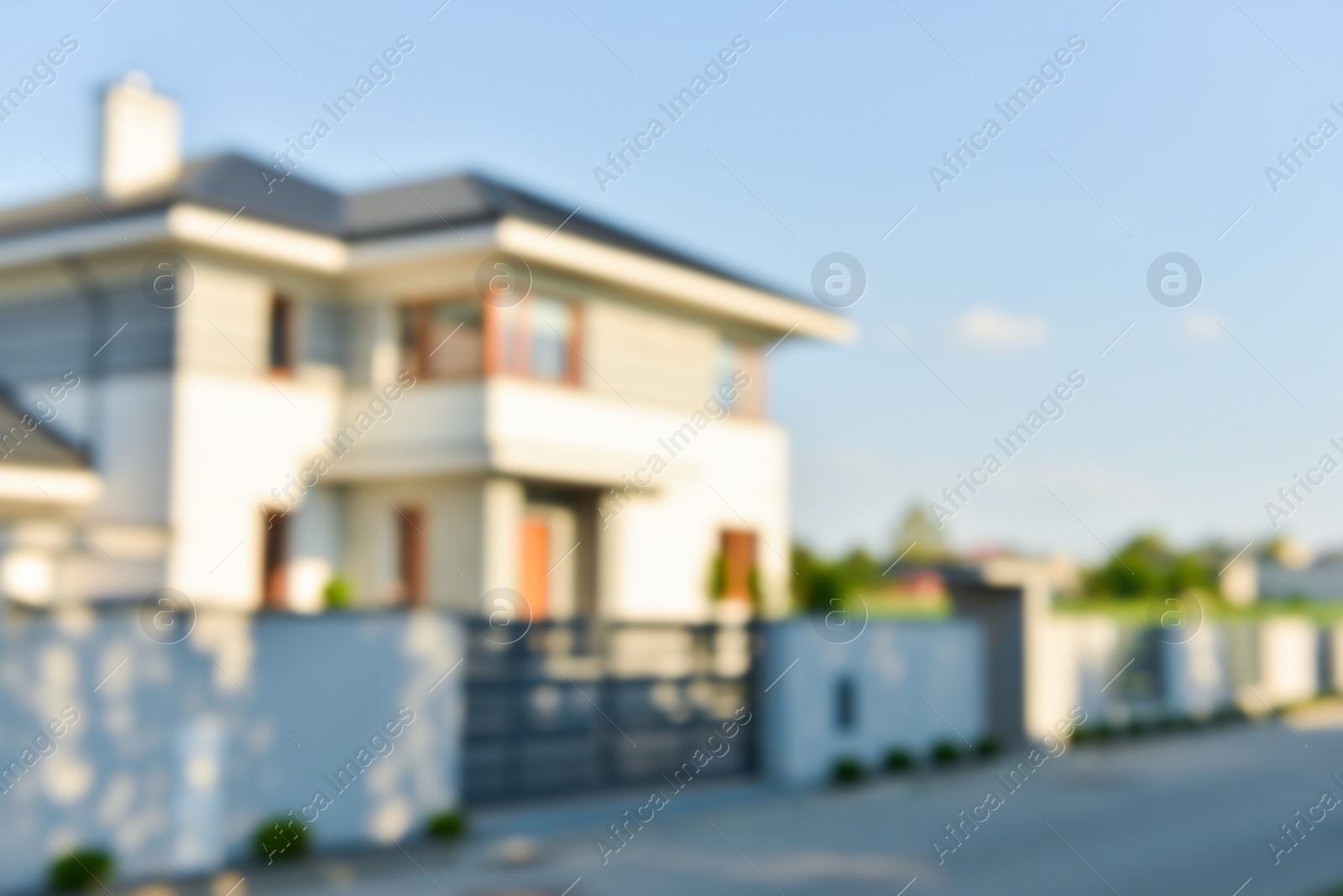 Photo of Blurred view of modern house on sunny day