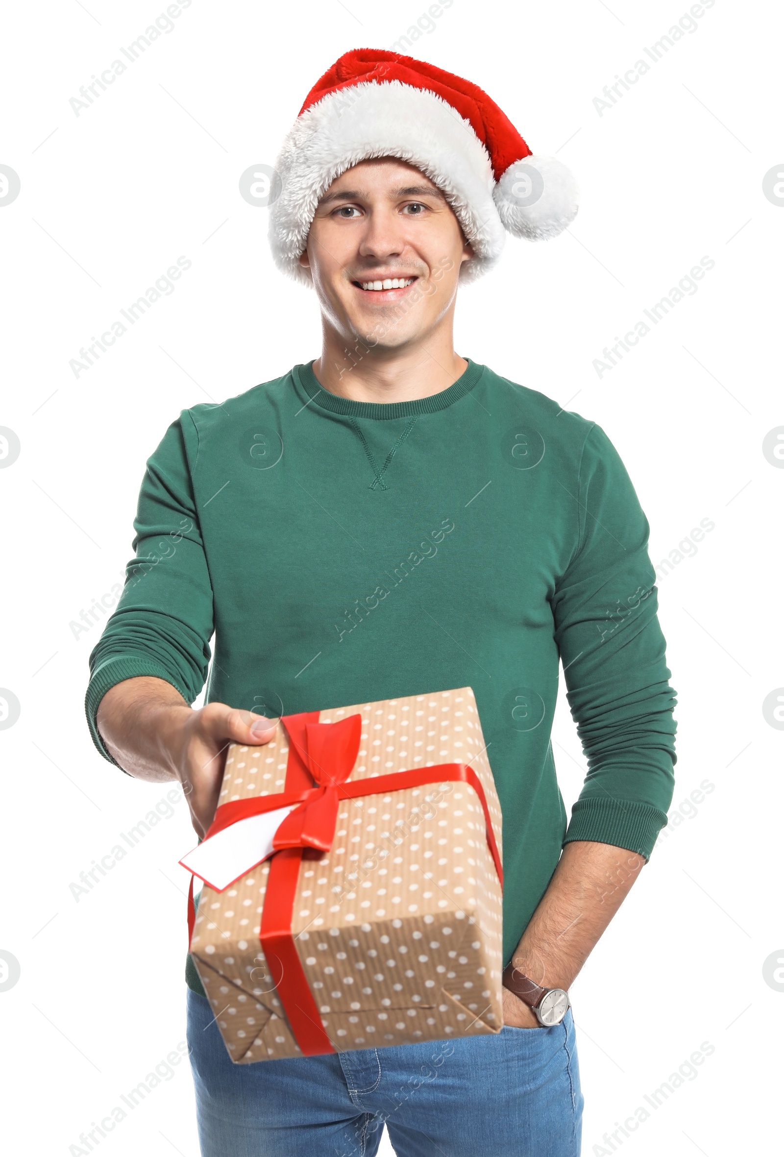 Photo of Young man with Christmas gift on white background