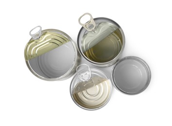 Photo of Open tin cans isolated on white, top view