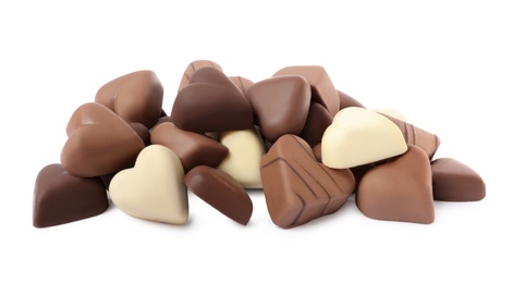 Delicious heart shaped chocolate candies on white background