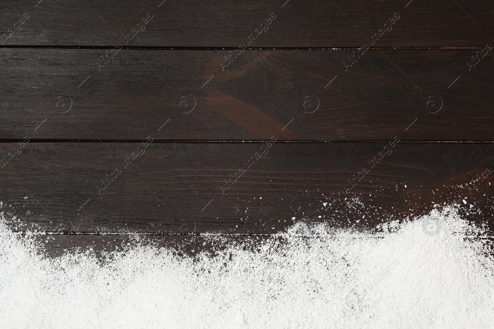 Photo of Artificial snow on wooden background, top view with space for text. Christmas decor