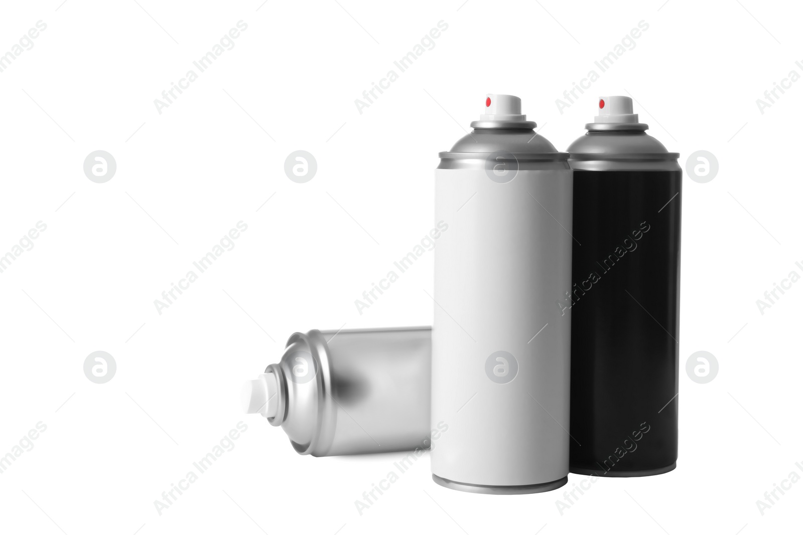 Photo of Cans of different spray paints on white background