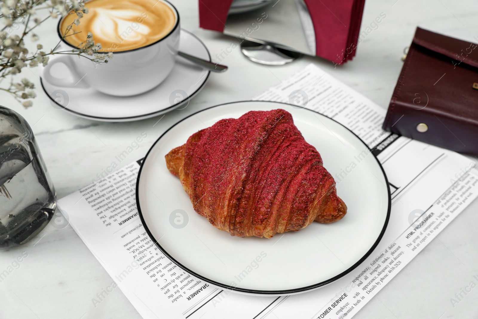 Photo of Delicious croissant and coffee on white marble table