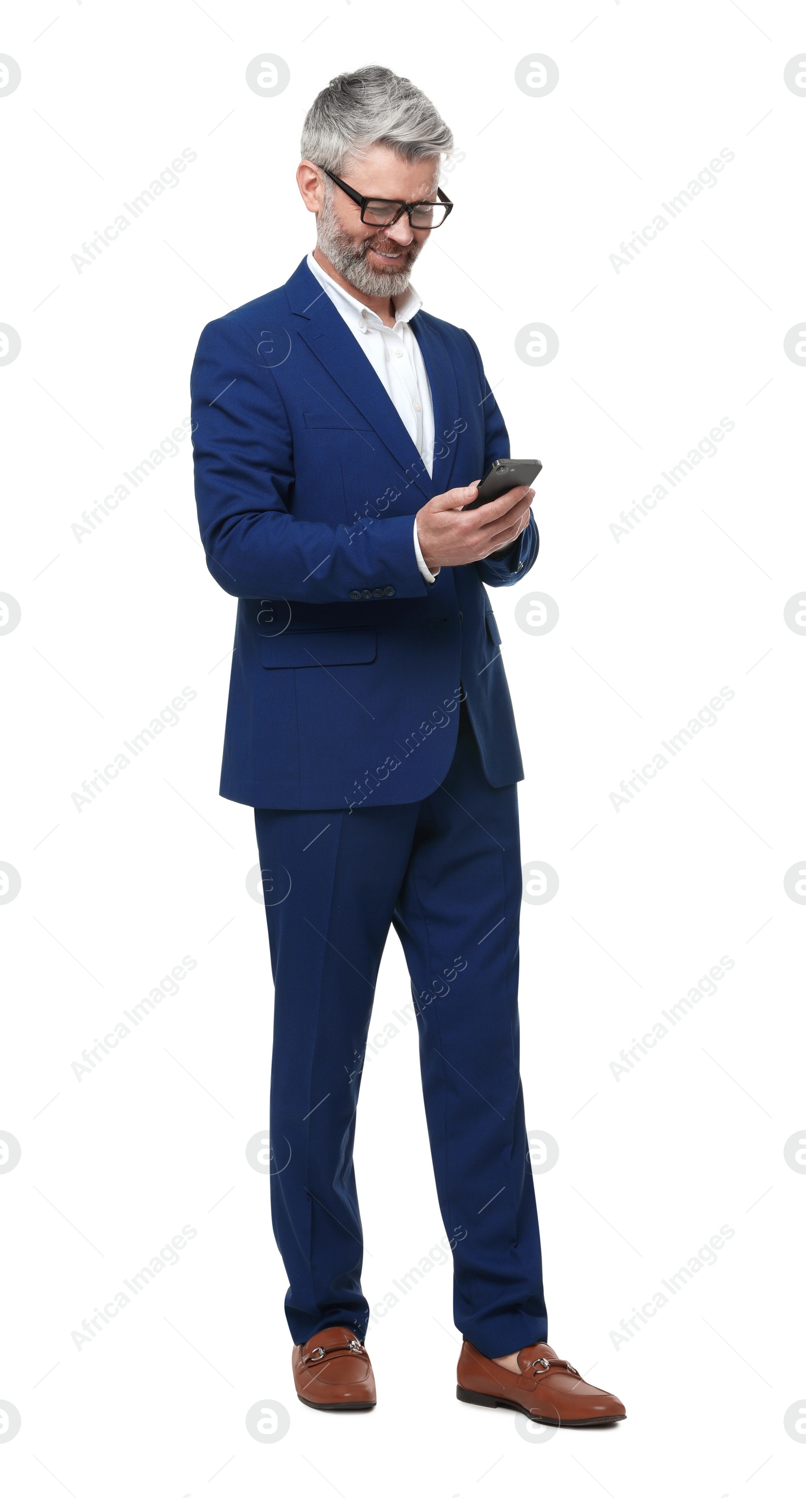 Photo of Mature businessman in stylish clothes using smartphone on white background