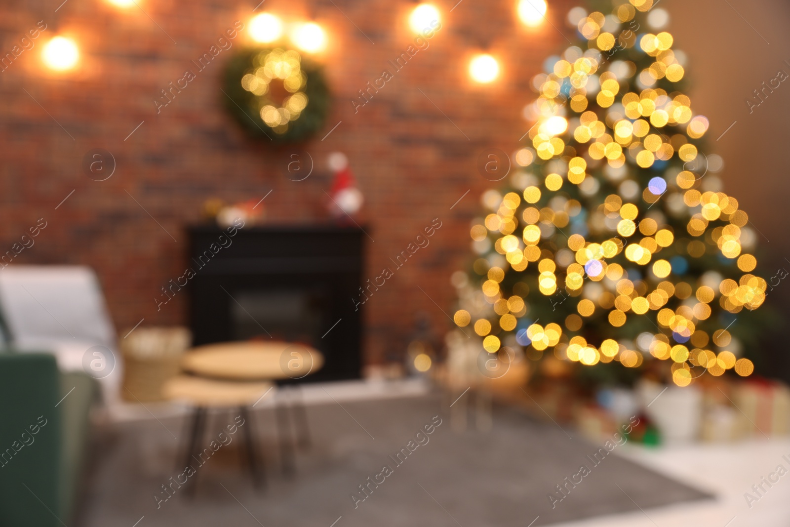 Photo of Blurred view of beautiful Christmas tree with lights in living room