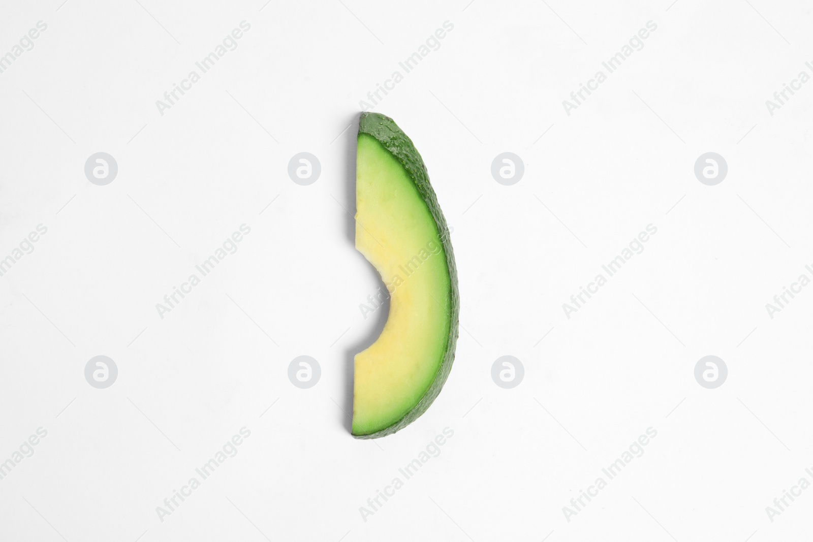 Photo of Slice of avocado on white background