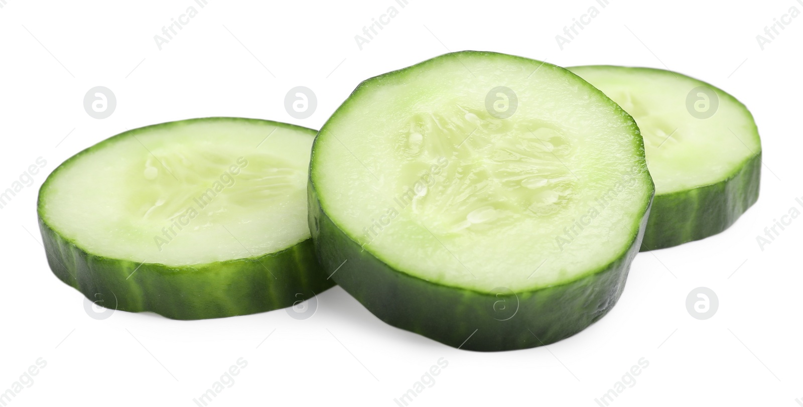 Photo of Slices of long cucumber isolated on white