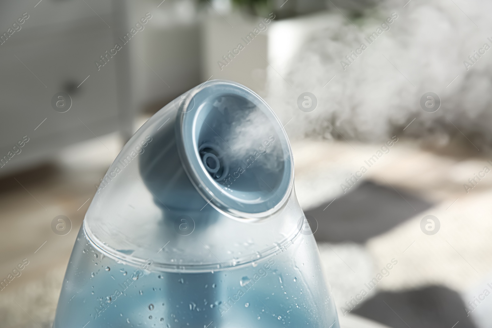 Photo of Modern air humidifier at home, closeup view