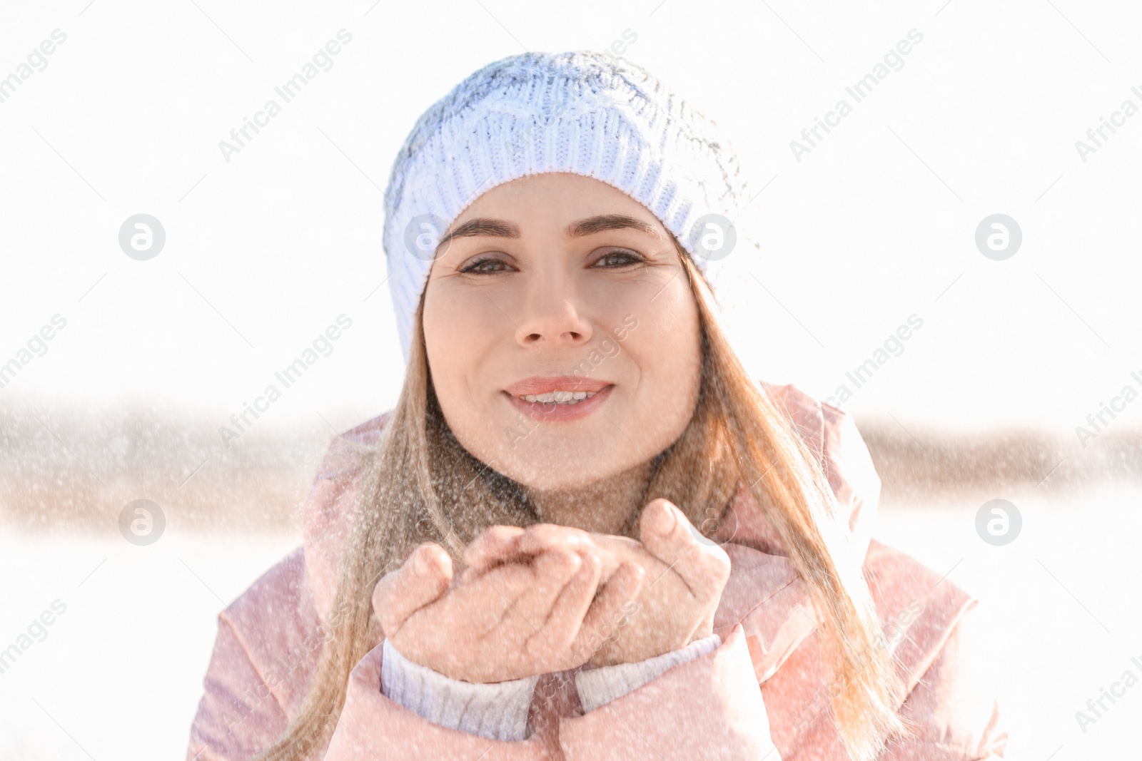 Photo of Portrait of happy woman outdoors on winter day